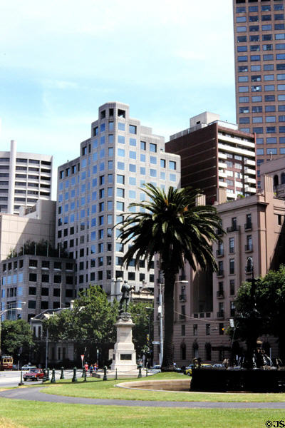 Palm tree, sculpture & fountain in Collins Place park, Melbourne. Melbourne, Australia.