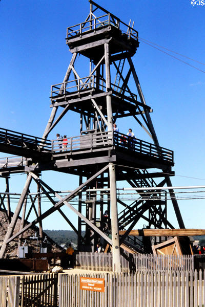 Tourists climb beam pump & derrick in former mining town of Ballarat. Ballarat, Australia.