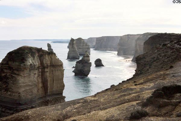 Twelve Apostles rock formations rise out of water in Port Campbell National Park. Australia.