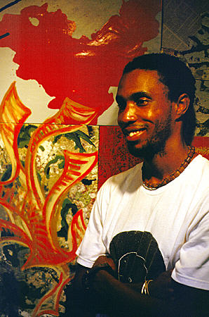 Artist John Cox with his painting 