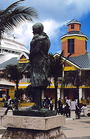 Statue honoring women who steered country through adversity stands at ship docks. Nassau, The Bahamas.