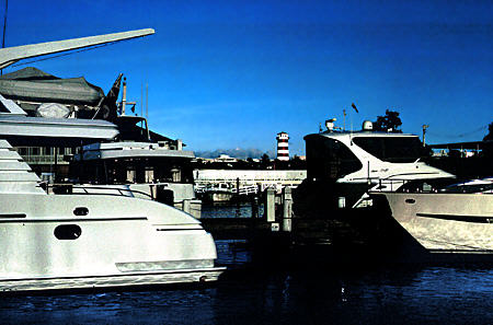 Sports fishing boat & lighthouse in Port Lucaya. The Bahamas.