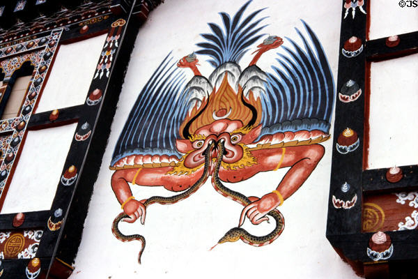 Demon-like mural on side of house in Paro. Bhutan.