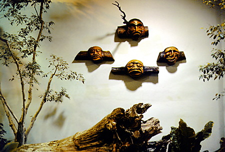 Native sculptures in indoor Devonian Gardens providing greenery in winter. Calgary, AB.