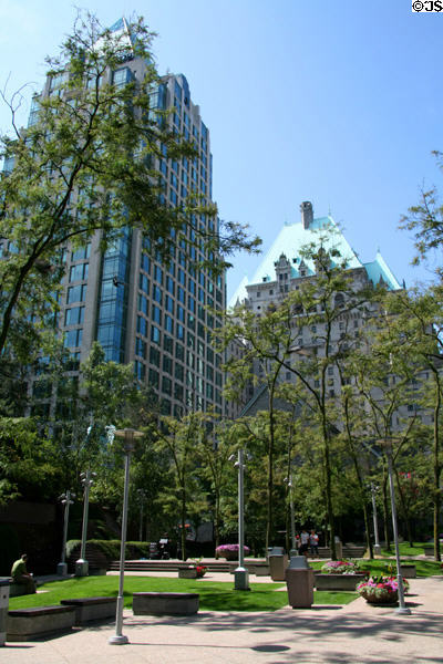 Christ Church Cathedral park with Cathedral Place & Hotel Vancouver. Vancouver, BC.