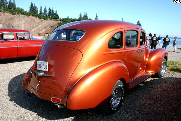40s vintage orange hotrod at car rally. NB.