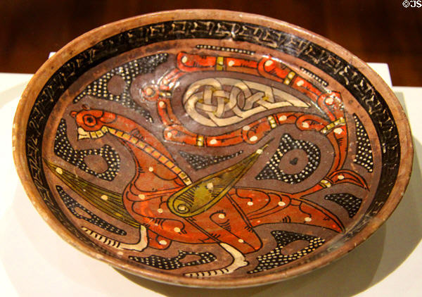 Earthenware bowl with underglaze slip-painting of peacock (10thC) from Iran or Central Asia at Aga Khan Museum. Toronto, ON.