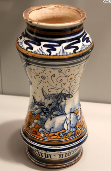 Majolica albarello drug jar with scene of mating donkeys (suggesting aphrodisiac? storage) (late 15th C) from Faenza or Pesaro, Italy at Gardiner Museum. Toronto, ON.