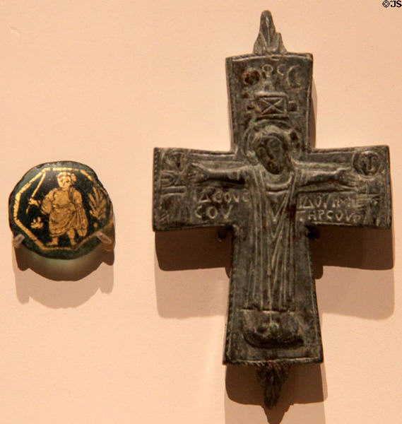 Gilded glass medallion show Christ as youth (300-400 CE) from Rome & bronze Reliquary Crucifix (900-1000 CE) from Eastern Mediterranean at Royal Ontario Museum. Toronto, ON.