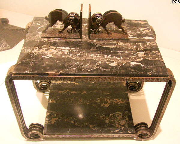Art Deco side table in marble & wrought iron (1920s) & bronze bookends with rams (1920s) by Paul Kiss of France at Royal Ontario Museum. Toronto, ON.