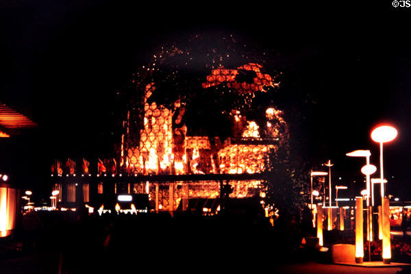Buckminster Fuller's Geodesic dome (1967) of United States Pavilion lighted internally at night at Expo 67. Montreal, QC.