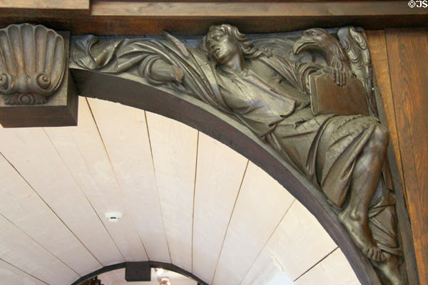 Evangelist John with eagle attribute sculpture (1678) on gateway to churchyard of St Jacobi by Christian Precht at Hamburg History Museum. Hamburg, Germany.