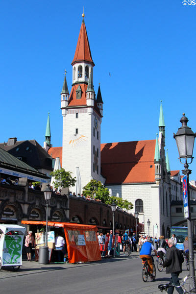 Sundial on Talburg Gate tower of Altes Rathaus seen from market area. Munich, Germany.