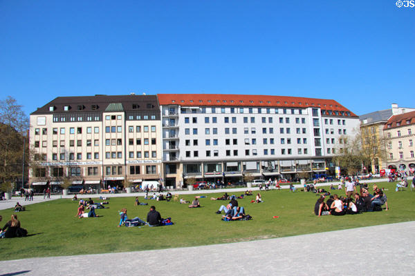 Sunbathers on Marienhof. Munich, Germany.