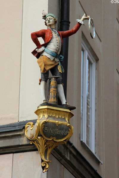 Shop sign on corner of Marienhof. Munich, Germany.