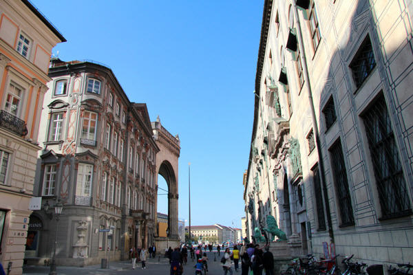 Streetscape with Feldherrnhalle on left & Munich Residenz on right. Munich, Germany.