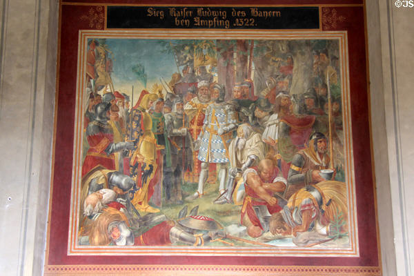 History mural on arcade building across garden courtyard from Munich Residenz. Munich, Germany.