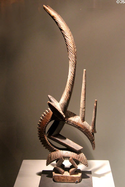 Carved headgear mask combining horse & antelope figures from Bamana culture of Mali at Five Continents Museum. Munich, Germany.