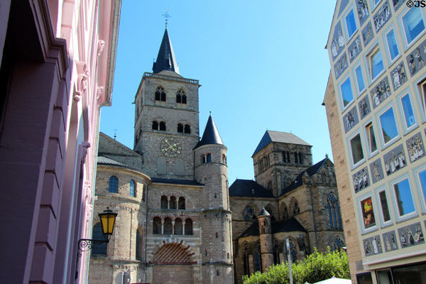 Highest tower (11thC) with golden clock of Trier Cathedral & neighboring Liebfrauenkirche. Trier, Germany.