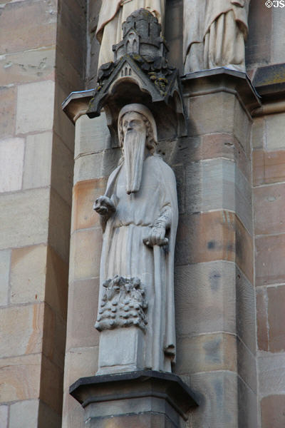Religious statue on Liebfrauenkirche facade. Trier, Germany.