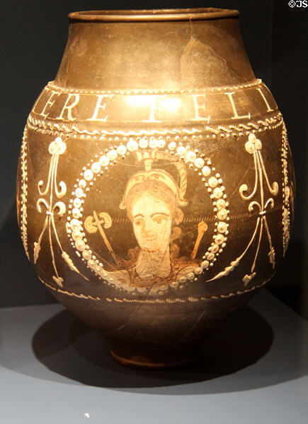 Ceramic wine jug with painted face & Latin saying 'Drink & Use Happily' exported from Trier to Roman empire (c300 CE) at Trier Archaeological Museum. Trier, Germany.