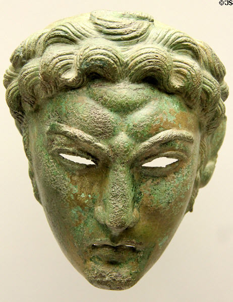 Roman bronze face mask of a parade helmet for equestrian fighting games found Straß-Moos at Bavarian State Archaeological Collection. Munich, Germany.