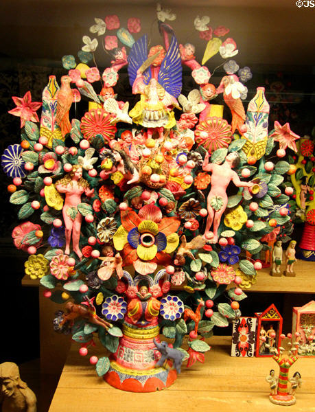 Adam & Eve in paradise sculpted array at folk art Collection Gertrud Weinhold. Munich, Germany.