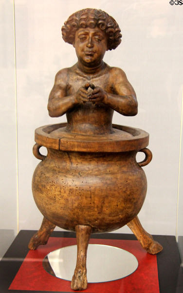 St Vitus in Cauldron of Boiling Oil woodcarving (1520) by Veit Stoß from Nuremberg at Germanisches Nationalmuseum. Nuremberg, Germany.