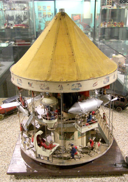 Miniature carrousel with airplanes & zeppelins at City Toy Museum. Nuremberg, Germany.