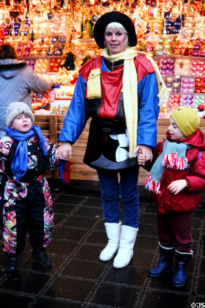 Visitors at Christmas Market on City Hall & Frauen Kirche square. Nuremberg, Germany.
