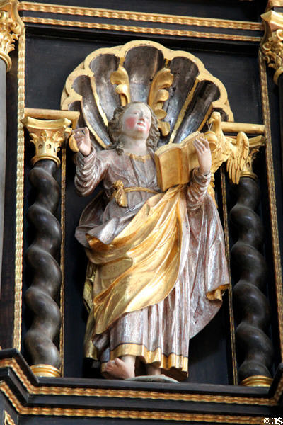 Statue of Evangelist St John with his eagle symbol in St Benedict church at Benediktbeuern Abbey. Germany.