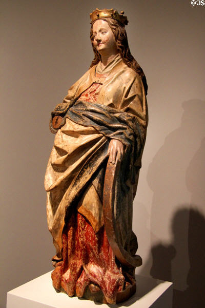 St Catherine of Alexandria carving (c1450-60), holding a piece of a wheel, her symbol from workshop of Hans Multscher at Ulmer Museum. Ulm, Germany.