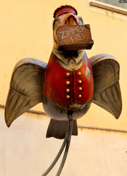 Ulm sparrow street art carrying room for rent (Zimmer Frei) sign. Ulm, Germany.