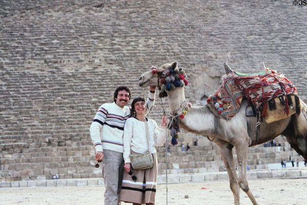 Tourists with camel at Great Pyramid. Giza, Egypt.