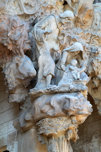 Holy family around manger on Nativity Facade at Sagrada Familia. Barcelona, Spain.