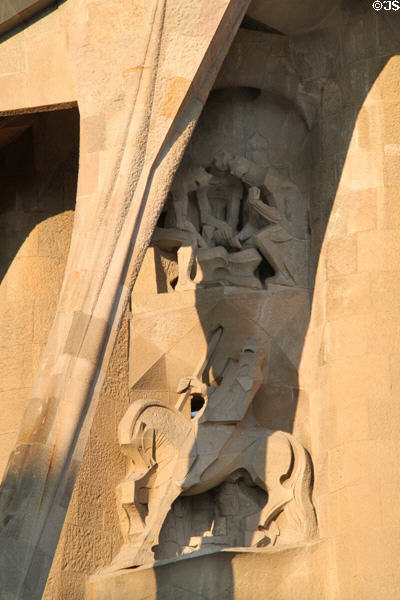 Gambling for coat of Christ over centurion Longinus on Passion Facade at Sagrada Familia. Barcelona, Spain.