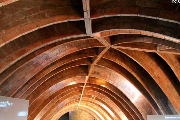 Attic catenary arches which support roof terrace above at Casa Milà. Barcelona, Spain.