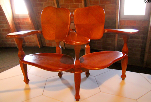 Modernista double chair replica (1904-6) from Casa Batlló in Barcelona by Antoni Gaudí at Casa Milà. Barcelona, Spain.