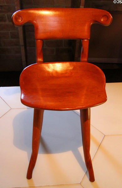 Modernista chair replica (1904-6) from Casa Batlló in Barcelona by Antoni Gaudí at Casa Milà. Barcelona, Spain.