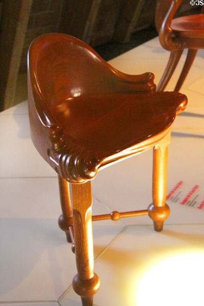 Modernista stool replica (c1900) from Casa Calvet in Barcelona by Antoni Gaudí at Casa Milà. Barcelona, Spain.