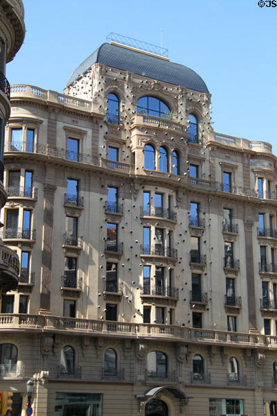 Building studded with security camera pods (Via Laietana 49). Barcelona, Spain.
