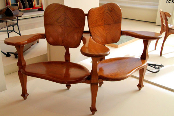 Modernista double chair (1904-6) from Casa Batlló in Barcelona by Antoni Gaudí at Museu Nacional d'Art de Catalunya. Barcelona, Spain.