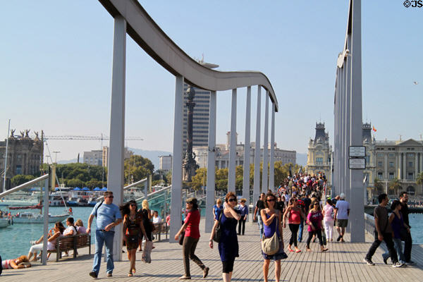 Rambla de Mar walkway with historic waterfront buildings beyond. Barcelona, Spain.