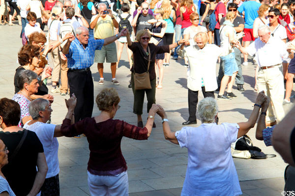 Barcelonans gather in Cathedral square for Sardana, a Catalan circle dance which served as symbol of Catalan independence during Franco. Barcelona, Spain.