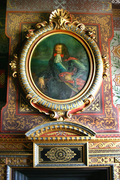 Detail of fireplace with portrait & clock in Chateau. Ancy-la-Franc, France.