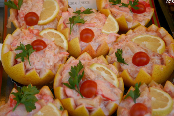 Shrimp in grapefruit in shop window. Beaune, France.