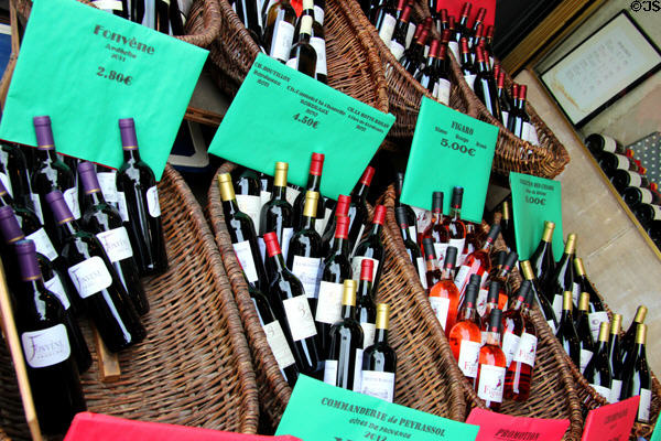 Wines displayed in basket on Paris streets. Paris, France.