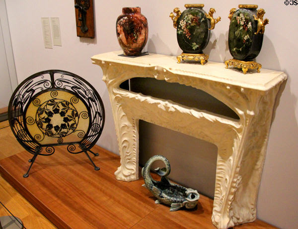 Fireplace (c1910) by Hector Guimard with Havilland vases & fireplace screen at Petit Palace Museum. Paris, France.