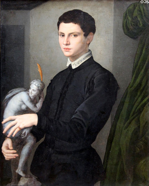 Portrait of man holding statuette by Bronzino at Louvre Museum. Paris, France.