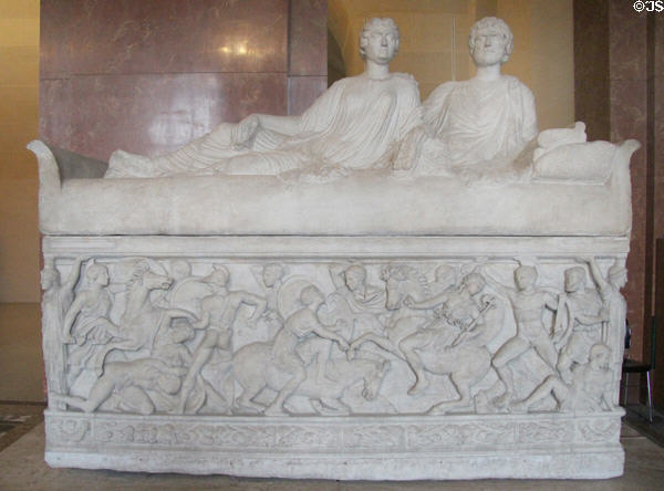 Marble sarcophagus with portrait carving of a couple on lid & scene of battle of Greeks & Amazons on front (c180 CE) found in Thessaloniki at Louvre Museum. Paris, France.